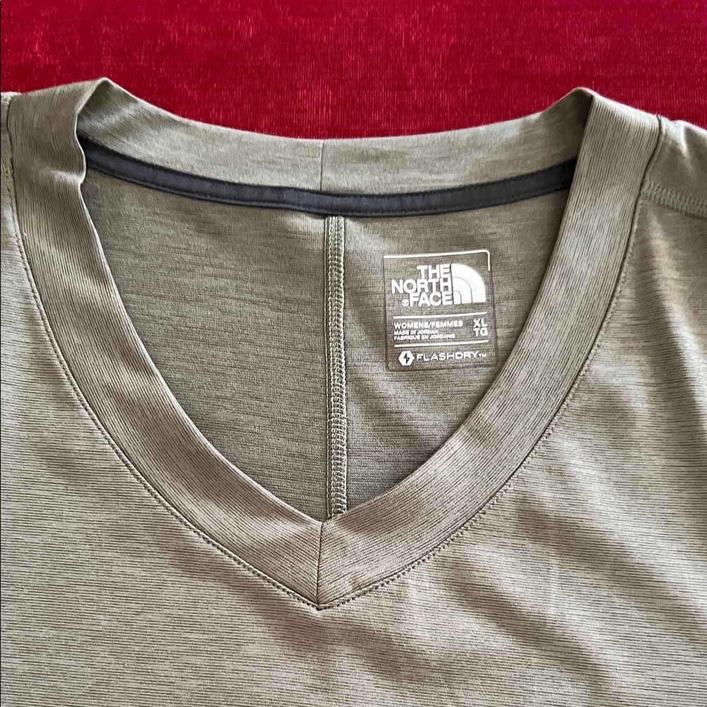 The North Face.  Women’s Flash dry Top.  Army green in color.  100% Poly